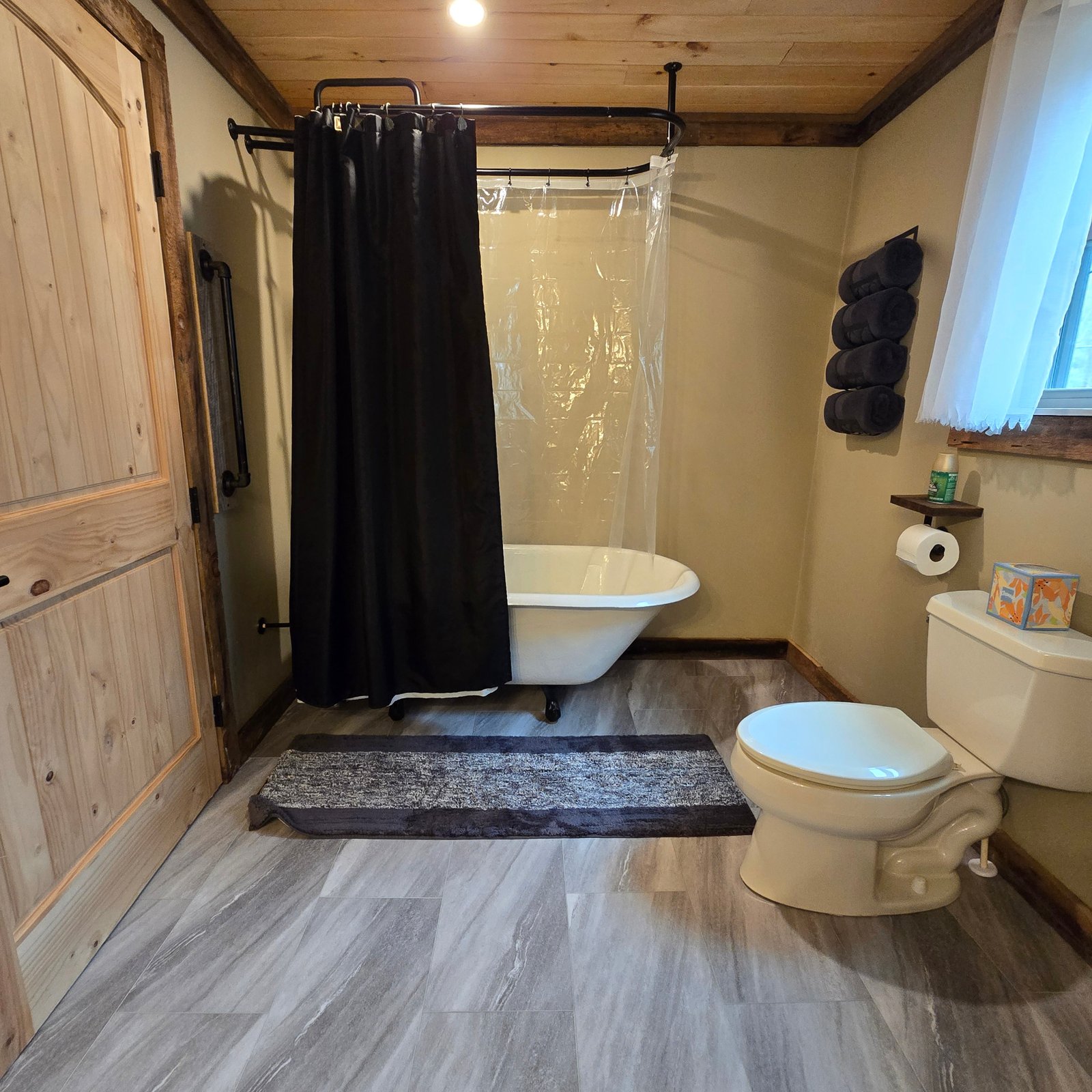 Cozy Cabin bathroom with claw-foot tub