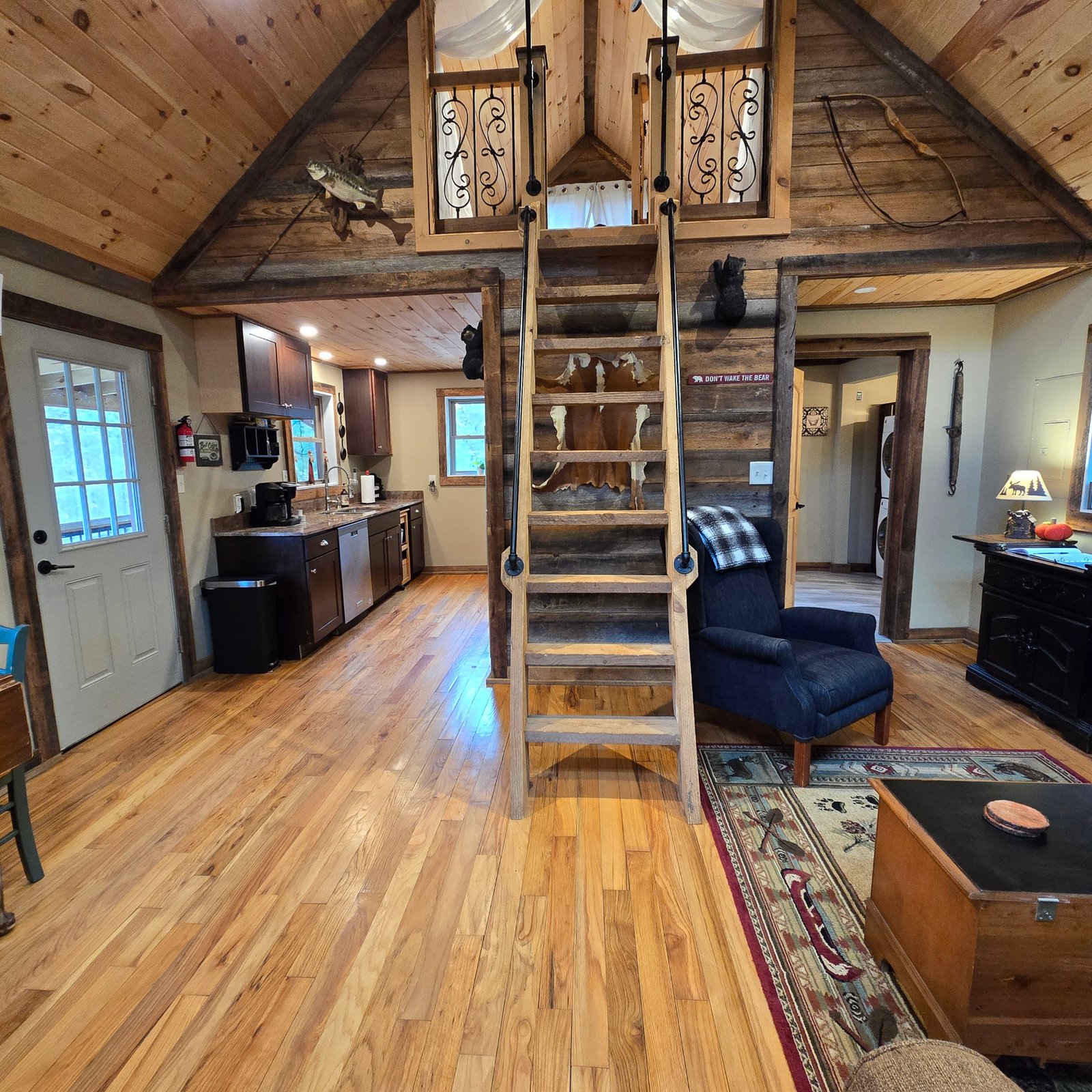 Full view of Cozy Cabin on entering, with kitchen and loft