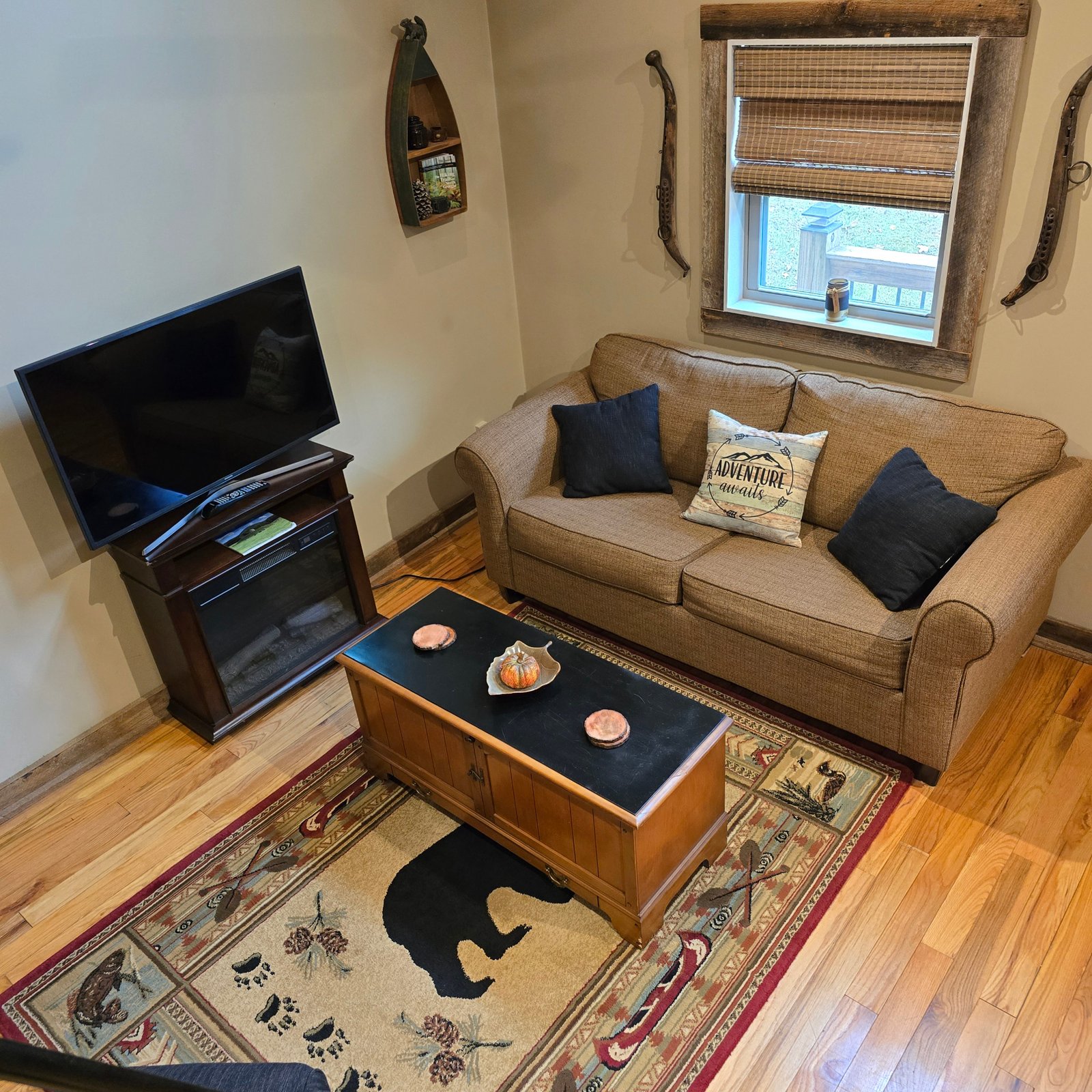 Cozy Cabin living area with sofa and television