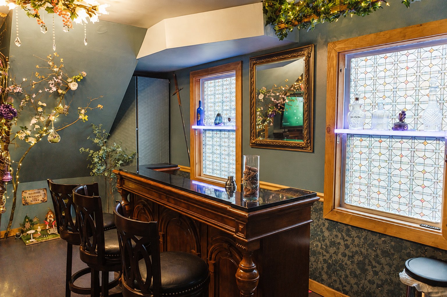 Villa Serena hidden room with a bar and stained glass windows