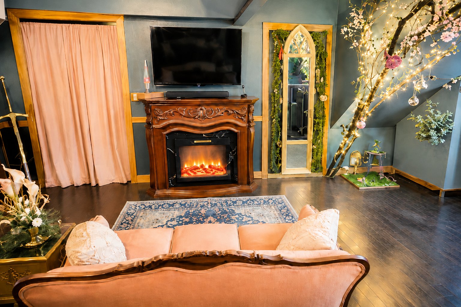 Villa Serena hidden room lounge with fireplace and sofa